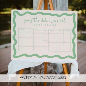 a guessing game board for the date of arrival of a baby named Adams. The board is set up on a wooden easel, and there is a white cloth draped over it.