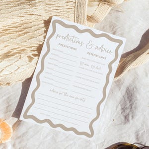 Baby shower prediction card gender neutral baby shower game advice for parent boho wave editable template prediction and advice for parents displayed on a ceramic plate over soft fabric with slices of citrus and a glass casting shadows minimalist neutral style printable keepsake activity for guests to fill with baby name birthday and wishes for new parents