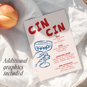 May include: A white card with the word "CIN CIN" in red, featuring a blue line drawing of a cocktail glass and a hand. The card lists beer, wine, signature drinks, and non-alcoholic options. A peach rests on a white cloth.