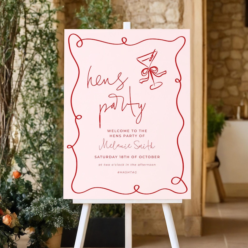 a pink sign with red text and a red ribbon design, welcoming guests to a party.