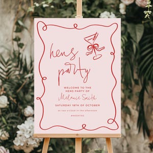 a pink sign with red text and a stylized illustration of a wine glass, welcoming guests to a party.