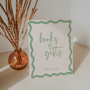 Letrero para baby shower con libros y regalos de género neutro, plantilla con borde retro ondulado, decoración verde salvia editable, descarga instantánea, imprimible BB36