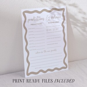 Gender neutral baby shower game prediction and advice for parents card with boho wave outline editable template baby shower prediction card placed on a stoneware plate over light fabric next to citrus and glassware relaxed modern table scene printable shower activity where guests record baby predictions and caring words for parents