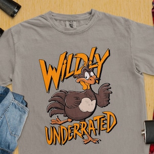 Camiseta gráfica de pájaro de dibujos animados tremendamente subestimada, camiseta gráfica divertida para adultos y niños, camiseta con diseño de personaje único