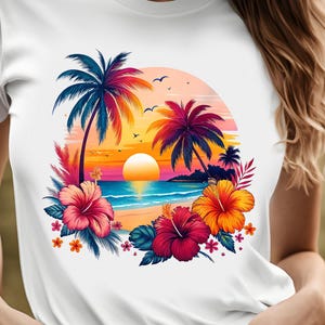 May include: White t-shirt with a colorful graphic print of a tropical sunset scene with palm trees, a beach, and hibiscus flowers.