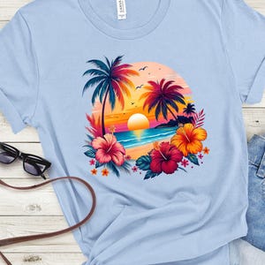 May include: Light blue t-shirt with a colorful graphic of palm trees, a sunset, and hibiscus flowers on a beach.