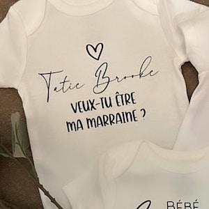 Cache-couche de bébé : demande de marraine et parrain.