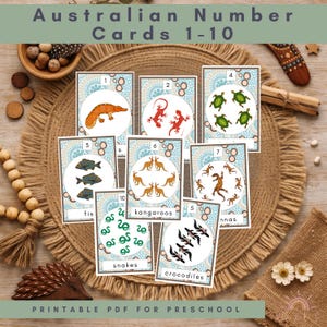 May include: Set of Australian Number Cards 1-10, featuring illustrations of Australian animals. Each card displays a number and a corresponding number of animals, such as crocodiles, kangaroos, and snakes. The cards are designed for preschool learning.