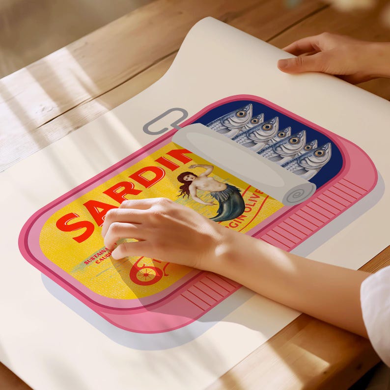 May include: A pink and yellow sardine can illustration with the word "SARDIN" in large red letters. The can features a mermaid graphic and a row of fish. The illustration is on a white surface.