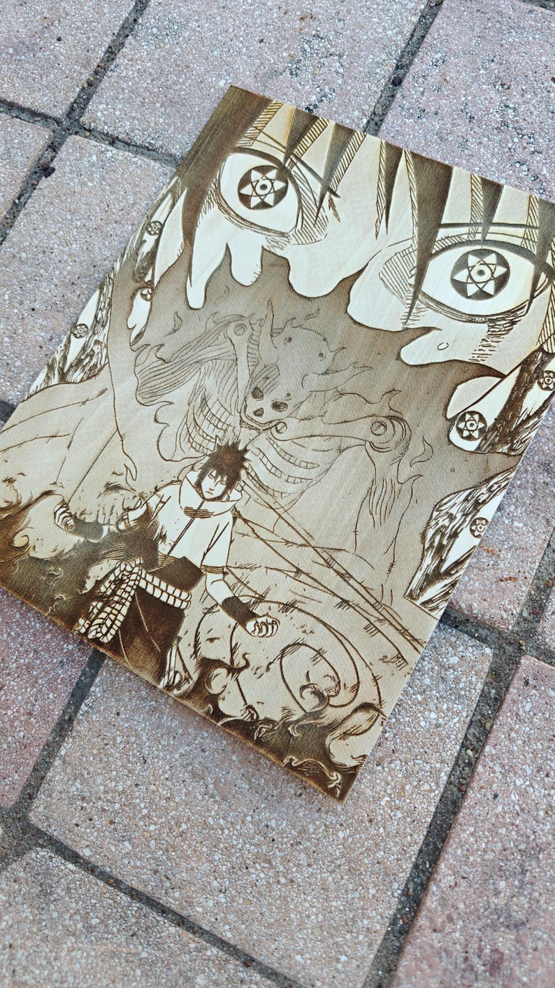May include: A wood-burned artwork featuring a manga-style illustration of a character with detailed eyes and a dynamic action pose. The artwork is in shades of brown and tan, with intricate line work.