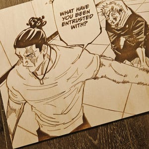 May include: Wooden artwork featuring a manga-style illustration with two characters. One figure is in the foreground, and the text bubble reads, "WHAT HAVE YOU BEEN ENTRUSTED WITH?" The artwork is on a wooden surface.