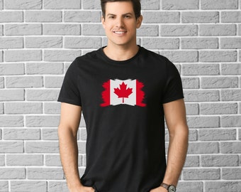 Pode incluir: Uma camiseta preta com um design de bandeira canadense desbotada. A bandeira é vermelha e branca com uma folha de bordo vermelha no centro.