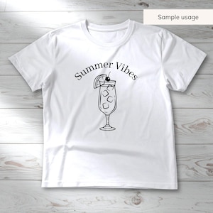 May include: White t-shirt with a black graphic of a cocktail with ice, a cherry, and a lemon slice. The words "Summer Vibes" are arched above the drink. The shirt is made of a soft material and is suitable for casual wear.