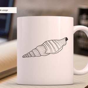 May include: White ceramic mug featuring a black and white illustration of a seashell. The seashell design is detailed with lines and dots. The mug has a curved handle and the text "Sample usage" is in the upper left corner.