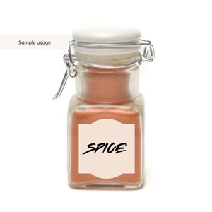 May include: A glass jar with a white lid and a silver latch. The jar is filled with a brown spice and has a label that says "SPICE".