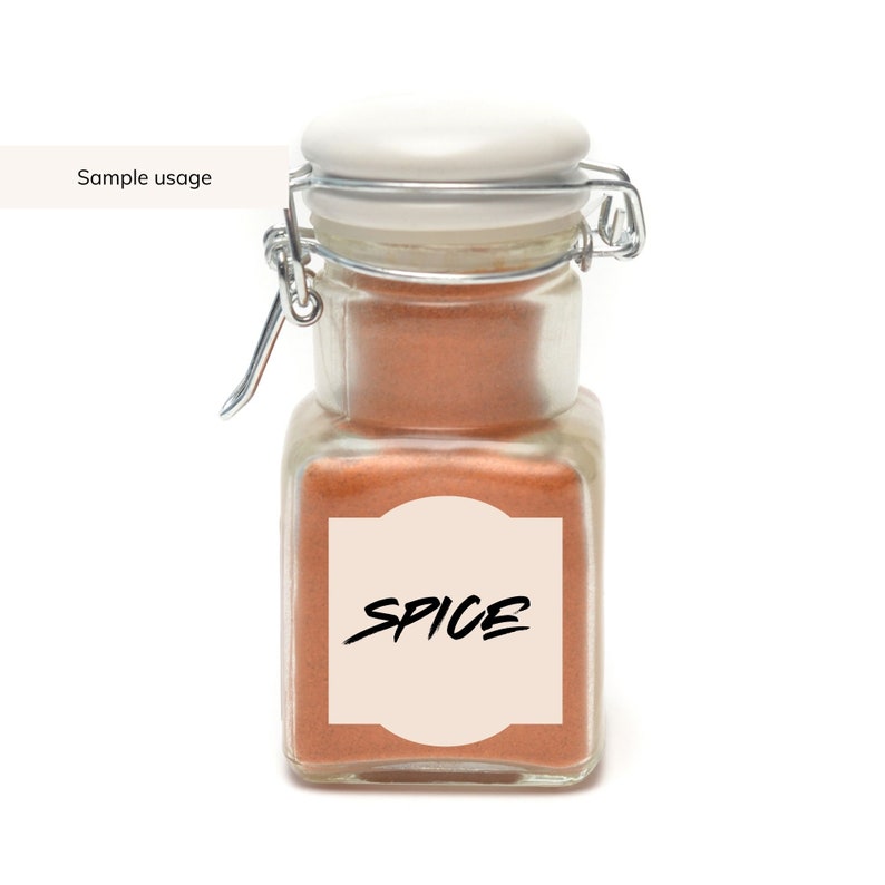 May include: A glass jar with a white lid and a silver latch. The jar is filled with a brown spice and has a label that says "SPICE".