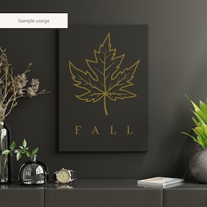 May include: A black and gold printable wall art design featuring a stylized maple leaf and the word "FALL" in gold lettering.