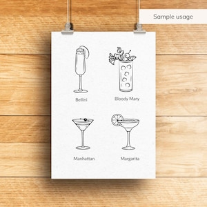 May include: A white poster with four cocktail illustrations in black line art: Bellini, Bloody Mary, Manhattan, and Margarita. The poster is held by two silver clips against a wooden background. The text "Sample usage" is at the top.