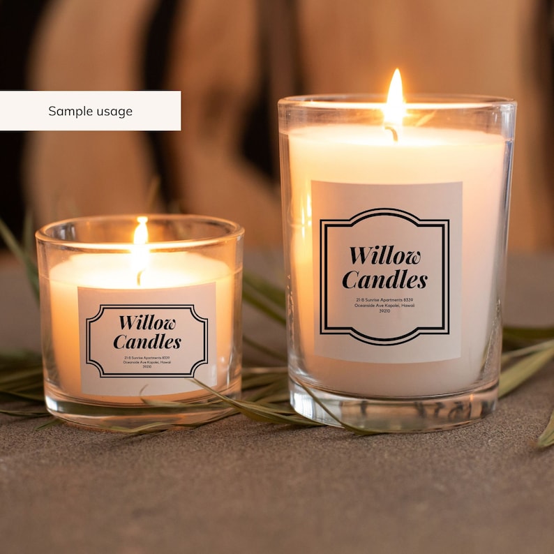 May include: Two glass candle jars with white candles and black labels that say "Willow Candles". The labels have a decorative border and include the address "21-B Sunrise Apartments #229, Oceanside Ave Kapiolani, Hawaii 96710".