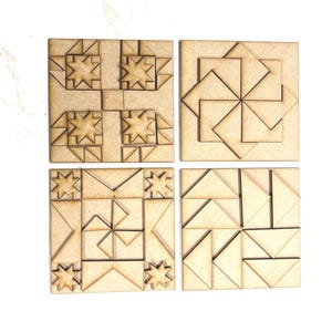 May include: Four wooden puzzle tiles with geometric designs. Each square tile features a unique pattern of interlocking shapes, including stars, triangles, and squares. The natural wood color provides a neutral backdrop for the intricate designs.
