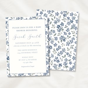 May include: A rectangular baby shower invitation card featuring a white center with blue text and a blue floral border, paired with a matching card back covered in a blue and white floral pattern. The text reads: PLEASE JOIN US FOR A BABY SHOWER HONORING Sarah Smith SATURDAY JULY 30 20XX eleven o'clock in the morning THE SMITH RESIDENCE 1234 ANYWHERE STREET KINDLY RSVP BY JULY 15 TO SARAH 123-456-7890 Registered at Target.