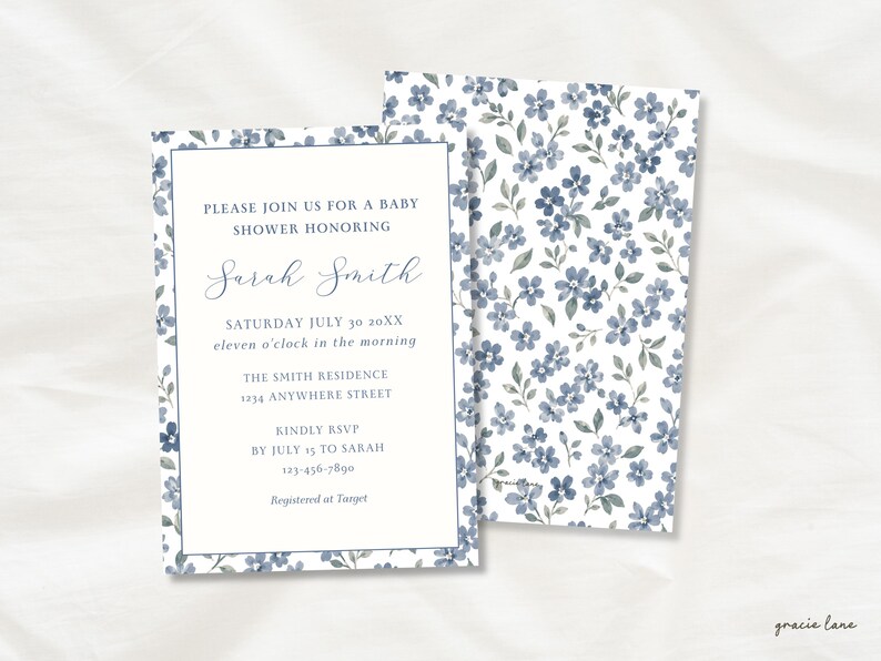May include: A rectangular baby shower invitation card featuring a white center with blue text and a blue floral border, paired with a matching card back covered in a blue and white floral pattern. The text reads: PLEASE JOIN US FOR A BABY SHOWER HONORING Sarah Smith SATURDAY JULY 30 20XX eleven o'clock in the morning THE SMITH RESIDENCE 1234 ANYWHERE STREET KINDLY RSVP BY JULY 15 TO SARAH 123-456-7890 Registered at Target.