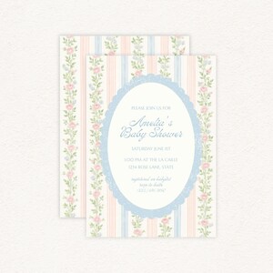 May include: Baby shower invitation with a floral and striped design. The invitation features pink and blue stripes with floral accents. The text reads "Amelia's Baby Shower" and includes event details.