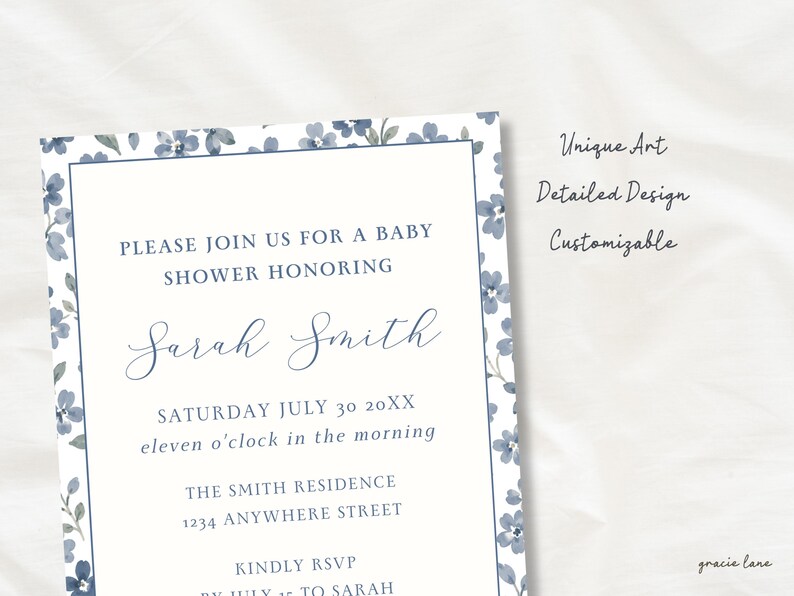 May include: A rectangular baby shower invitation card featuring a blue floral border and dark blue text that reads: PLEASE JOIN US FOR A BABY SHOWER HONORING Sarah Smith SATURDAY JULY 30 20XX eleven o'clock in the morning THE SMITH RESIDENCE 1234 ANYWHERE STREET.