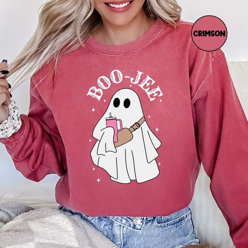 May include: A red sweatshirt with a white ghost holding a pink drink and the text "BOO-JEE" in white.