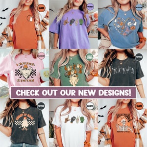 May include: A collection of nine different t-shirt designs featuring various Halloween-themed graphics, including ghosts, skeletons, and pumpkins. The shirts are available in a variety of colours, including orange, purple, green, and black.