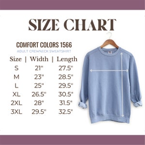 May include: Size chart for adult crewneck sweatshirts in Comfort Colors 1566. The chart shows sizes S through 3XL with corresponding width and length measurements in inches.