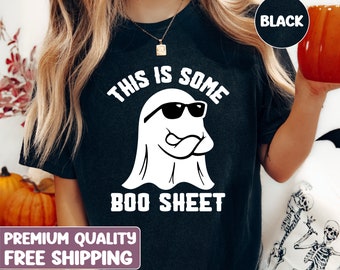 May include: Black t-shirt with a white ghost wearing sunglasses and the text "This is some boo sheet".