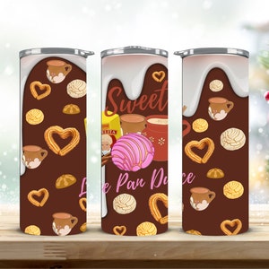 May include: Three stainless steel tumblers with a brown background and a white drip design. The tumblers feature a variety of Mexican pastries, including pan dulce, conchas, and churros. The text "Sweet Like Pan Dulce" is printed on the middle tumbler.