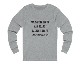May include: A heather grey long-sleeve t-shirt with the text "WARNING MAY START TALKING ABOUT HISTORY" printed in black.