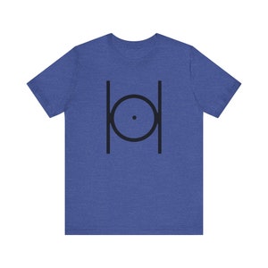 May include: A blue t-shirt with a black graphic of a circle with a dot in the center, surrounded by two vertical lines.