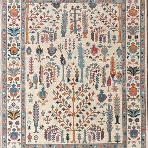 Handmade Ivory Oushak Rug: Beige & Blue Wool, Floral Turkish Knot