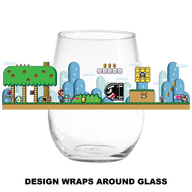 May include: A clear glass wine glass with a design of a video game level wrapped around it. The design features a green tree, blue clouds, a red character, and a yellow and black enemy.