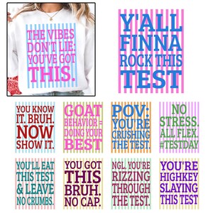 May include: White sweatshirt with the text "THE VIBES DON'T LIE: YOU'VE GOT THIS." in pink and blue. Additional graphics with phrases like "Y'ALL FINNA ROCK THIS TEST" and "YOU KNOW IT. BRUH. NOW SHOW IT."