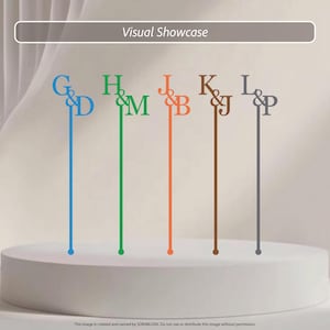 May include: Five thin, vertical cake toppers in blue, green, orange, brown, and gray. Each topper features a serif letter monogram with an ampersand, specifically G&D, H&M, J&B, K&J, and L&P. The text Visual Showcase appears at the top.