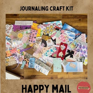 May include: A journaling craft kit containing a variety of colourful paper ephemera, stickers, tags, and patterned cards. The collection features diverse designs including smiley faces, floral prints, and text, all arranged in a scattered pile.