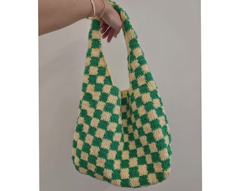 May include: A green and yellow checkered crocheted tote bag.