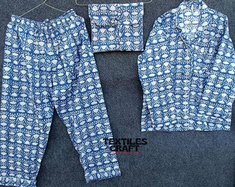 May include: A blue and white patterned pajama set with a long-sleeved shirt and pants. The set includes a matching pouch with a blue and white pattern.