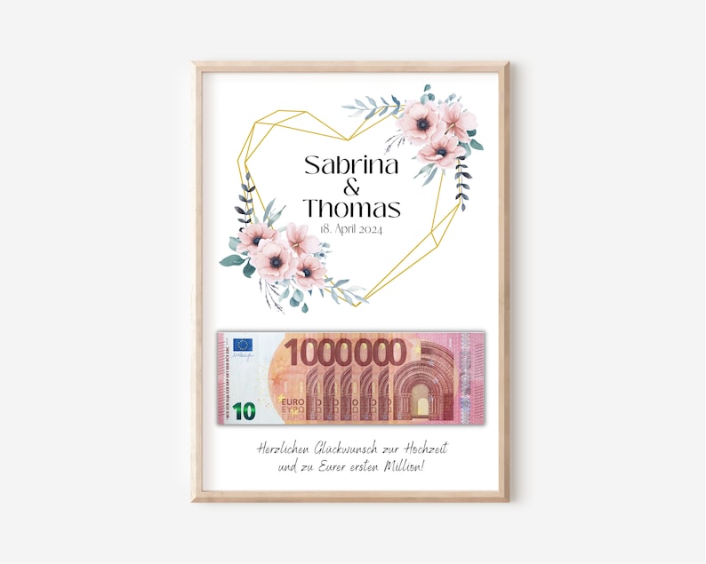 May include: A white card with a gold geometric heart design and pink flowers. The text "Sabrina & Thomas 18. April 2024" is printed on the card. A 10 Euro bill is placed on the card. The text "Herzlichen Gl&uuml;ckwunsch zur Hochzeit und zu Eurer ersten Million!" is printed below the bill.