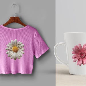 May include: A pink t-shirt with a white daisy print and a white mug with a pink daisy print.