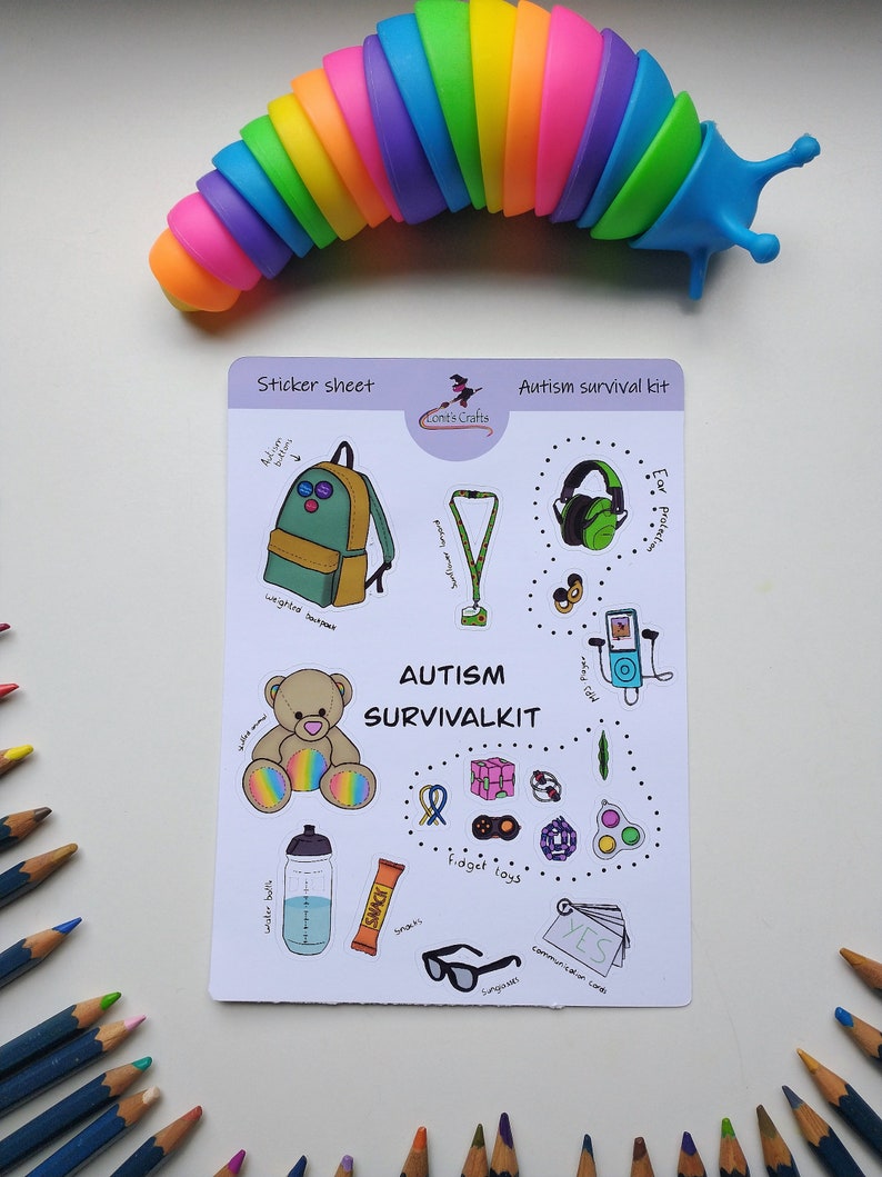 May include: A sticker sheet with a variety of images related to autism. The sheet includes a backpack, a weighted blanket, a fidget toy, a sensory toy, a communication card, and a pair of sunglasses. The text on the sheet reads "Autism Survival Kit".