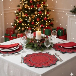 May include: A festive Christmas table setting with a white tablecloth, red napkins, and crocheted placemats. The table is set with silverware, wine glasses, and a lit candle centerpiece. A decorated Christmas tree and wrapped gifts are in the background.