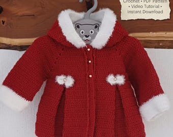 May include: A red crochet baby coat with white faux fur trim on the hood and cuffs. The coat has pearl-like buttons and decorative white flower accents. The image includes text that says "Crochet • PDF Pattern • Video Tutorial • Instant Download."