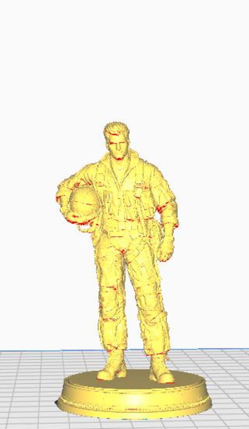 May include: A yellow figurine of a pilot in a flight suit, holding a helmet. The figure is standing on a round base. The pilot's uniform includes a flight suit, boots, and gloves.