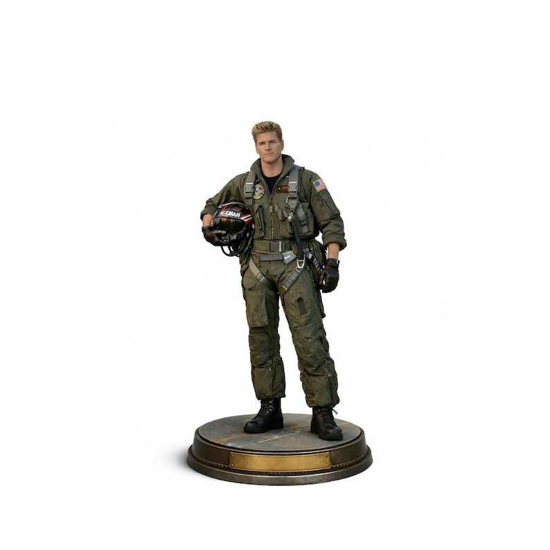 May include: A figurine of a man in a military flight suit, holding a helmet. The figure is standing on a circular base with a gold-colored band. The flight suit is olive green, and the helmet is black with red and white accents.