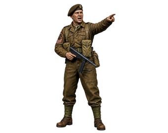 May include: A detailed scale figurine of a soldier wearing a brown uniform, a beret, and combat boots. The figure holds a submachine gun in one hand while pointing forward with the other, featuring realistic fabric textures, pouches, and military insignia.
